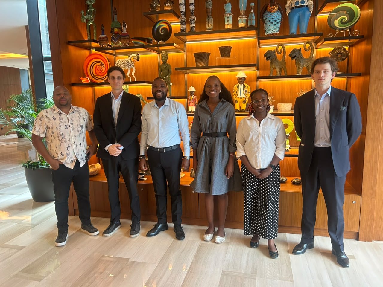 The Twende Green Planet team and guests from Vantra standing together in a hotel lobby in Nairobi